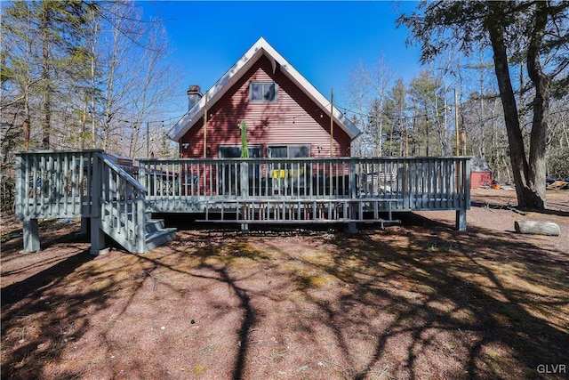 back of property with a wooden deck