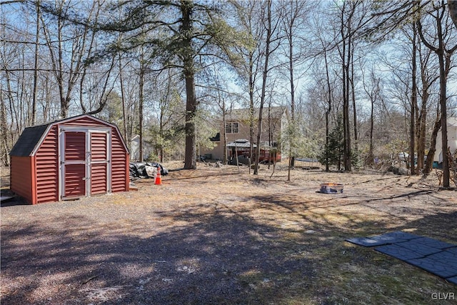 view of yard with an outbuilding and a storage unit