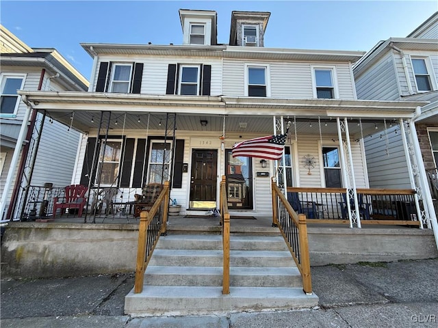 view of property featuring a porch