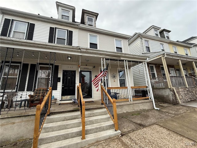 view of property with covered porch