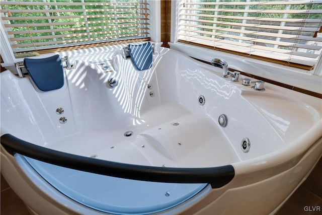 full bath featuring a tub with jets