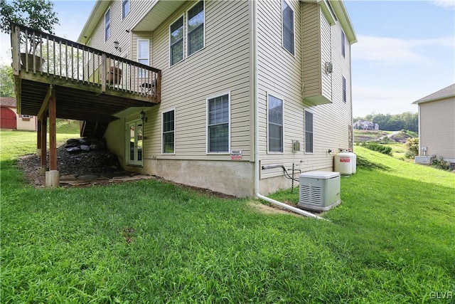 view of home's exterior with a lawn and a deck