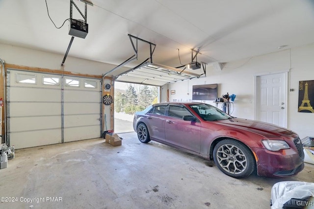 garage featuring a garage door opener