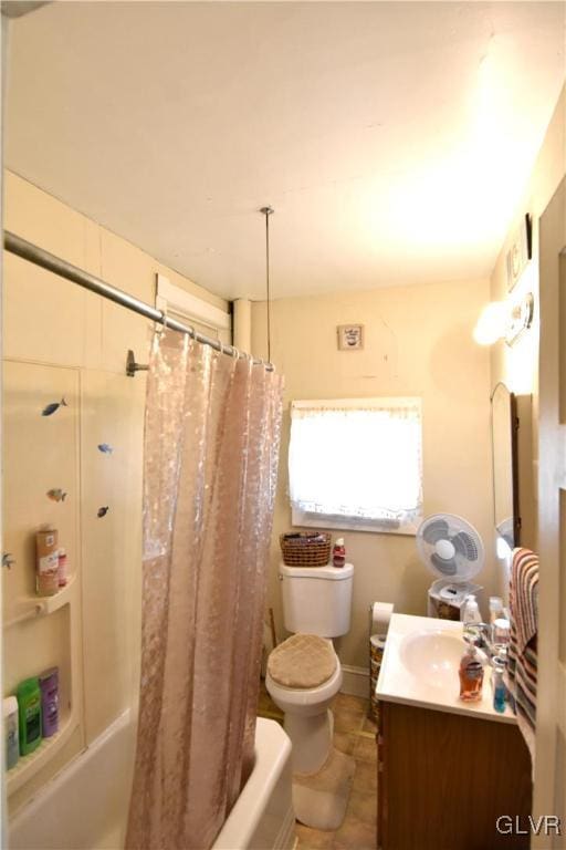 full bath featuring toilet, vanity, and shower / bathtub combination with curtain