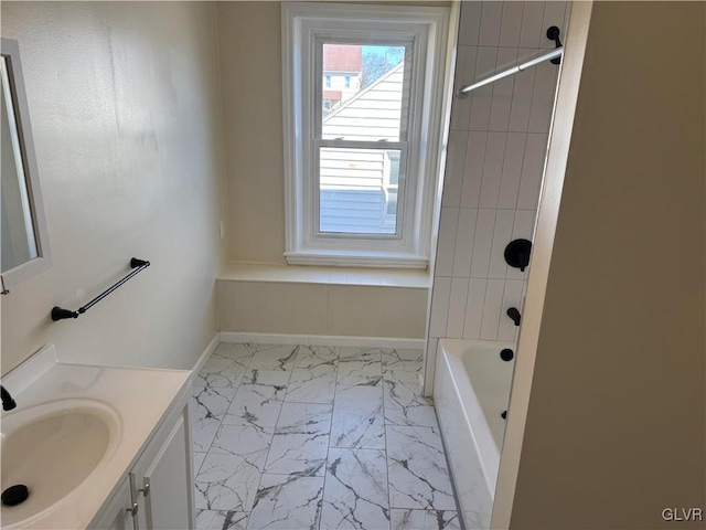 full bathroom with marble finish floor, shower / bathing tub combination, vanity, and baseboards