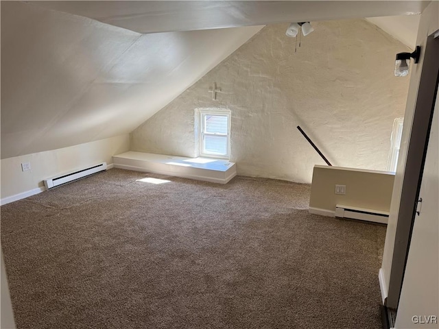 bonus room featuring carpet floors, vaulted ceiling, a baseboard heating unit, and baseboard heating