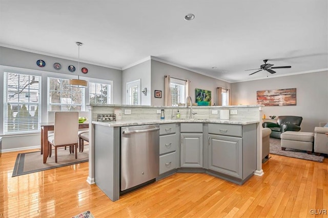 kitchen with dishwasher, ornamental molding, plenty of natural light, and gray cabinets