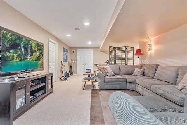 carpeted living room featuring recessed lighting and visible vents