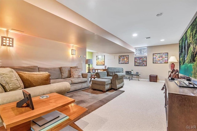 living room featuring carpet floors, baseboards, and recessed lighting