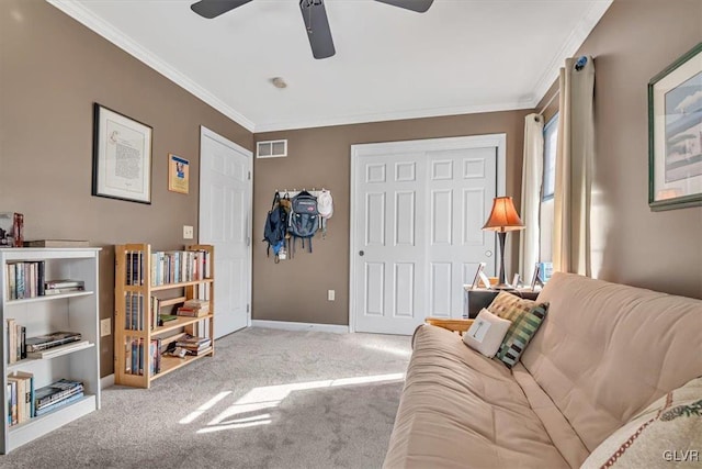 living area featuring carpet floors, crown molding, visible vents, ceiling fan, and baseboards