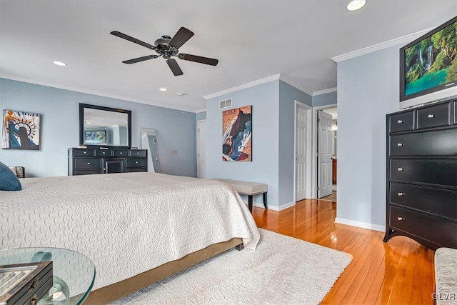 bedroom featuring baseboards, visible vents, crown molding, light wood-style floors, and recessed lighting