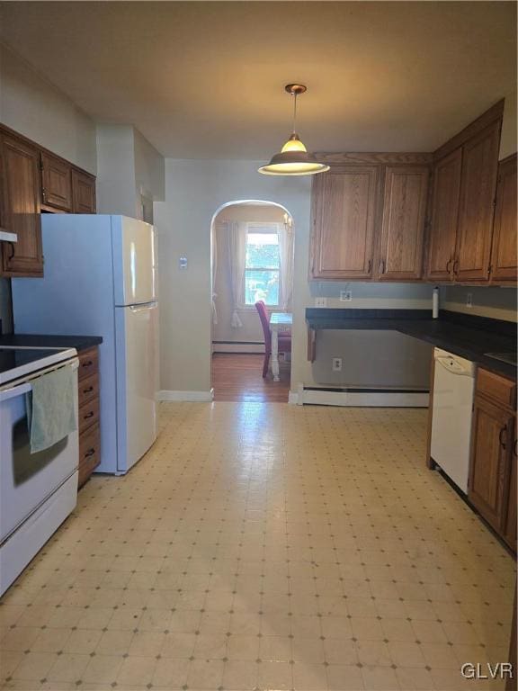 kitchen featuring dark countertops, a baseboard heating unit, light floors, arched walkways, and white appliances