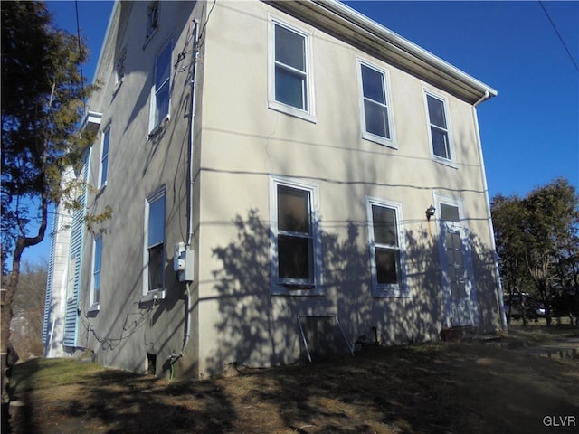 view of property exterior with stucco siding