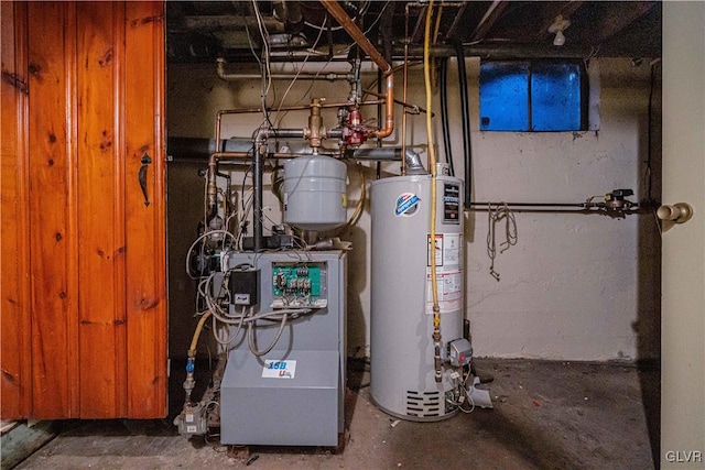 utility room with gas water heater and a heating unit