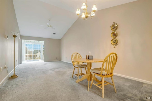 dining area featuring carpet flooring, ceiling fan with notable chandelier, high vaulted ceiling, and baseboards