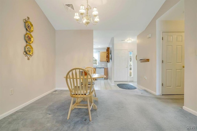 unfurnished room with a chandelier, visible vents, baseboards, and carpet floors