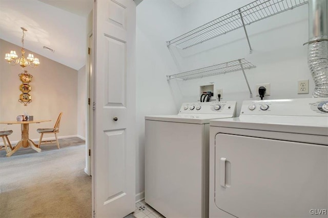 laundry area featuring laundry area, light colored carpet, independent washer and dryer, and visible vents