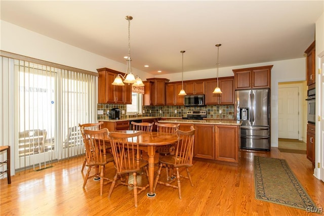 dining room with light wood finished floors