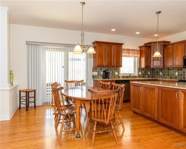 dining space featuring light wood finished floors and recessed lighting