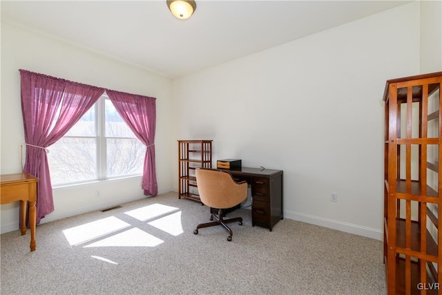 office area featuring visible vents, baseboards, and carpet