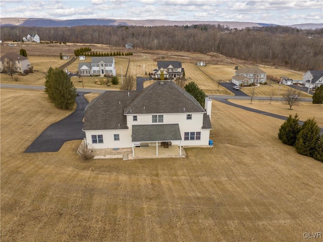 drone / aerial view featuring a mountain view