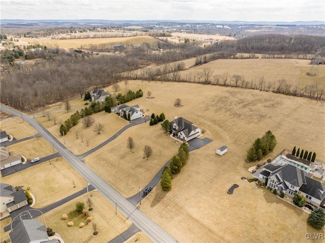 birds eye view of property with a rural view