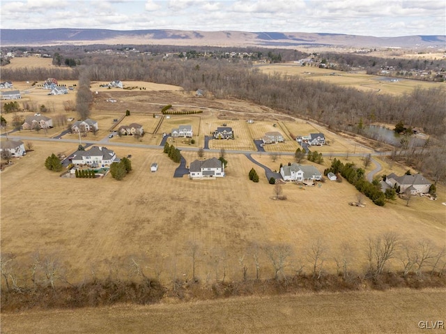 bird's eye view featuring a rural view and a mountain view