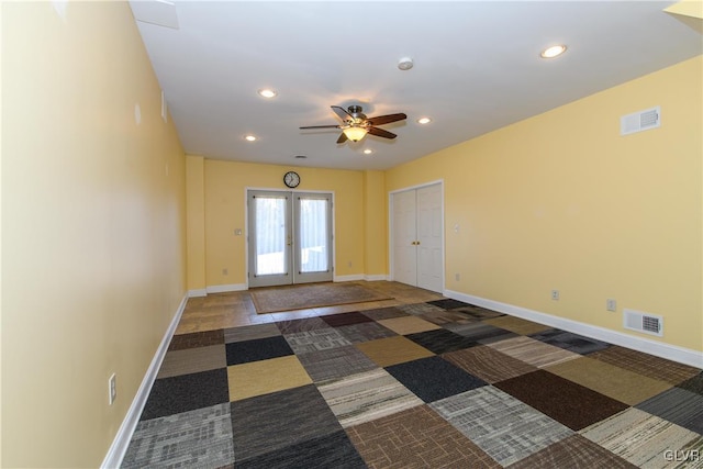 empty room featuring recessed lighting, visible vents, baseboards, and french doors