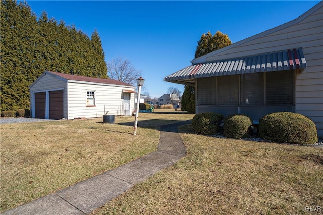 view of yard with an outdoor structure and a garage