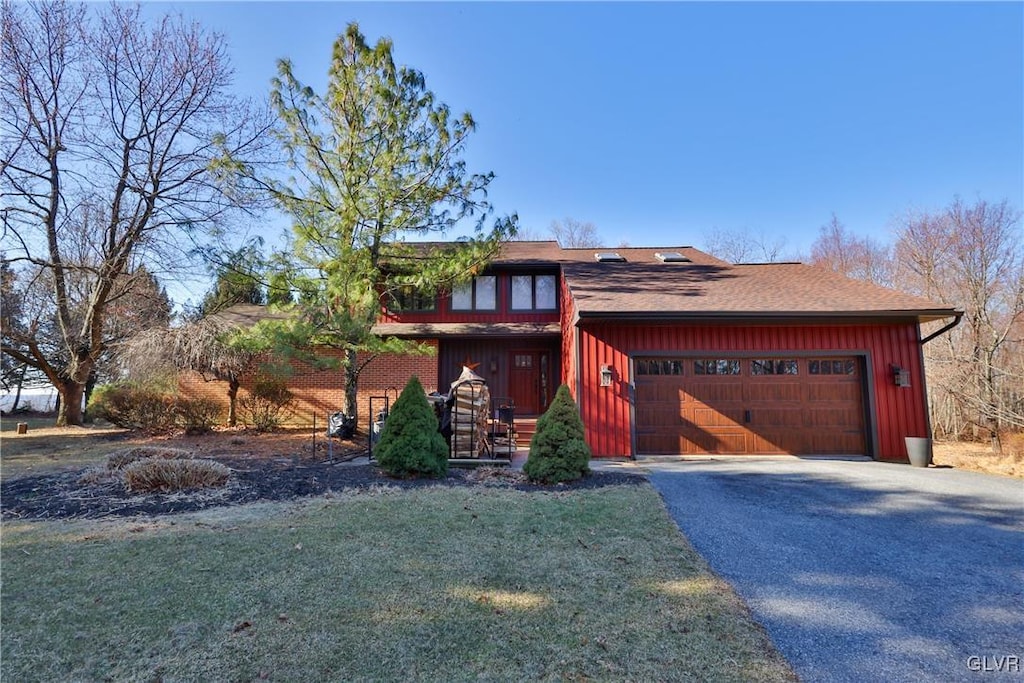 view of front of home featuring an attached garage and driveway