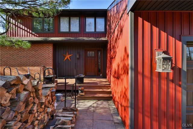 property entrance featuring brick siding