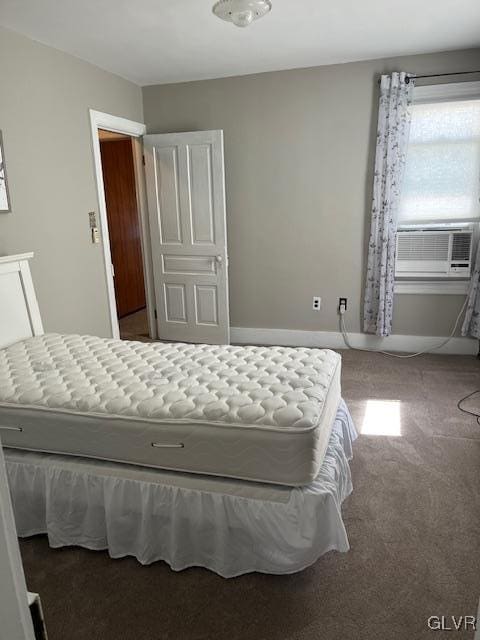 bedroom with carpet flooring, cooling unit, and baseboards