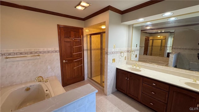 full bathroom featuring tile walls, a stall shower, a whirlpool tub, and a sink