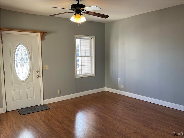 entrance foyer featuring baseboards, dark wood-type flooring, and a ceiling fan