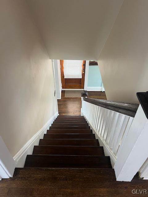 stairs with wood finished floors