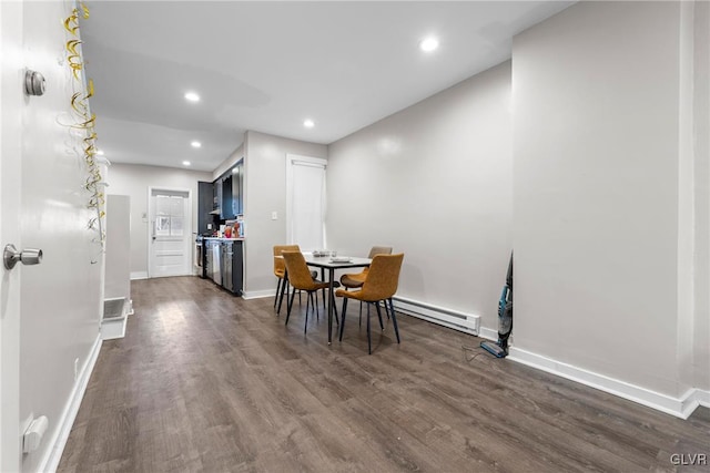 dining space featuring recessed lighting, a baseboard radiator, baseboards, and dark wood finished floors