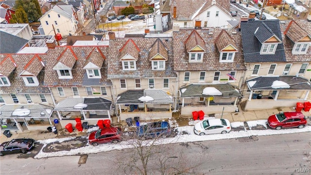 birds eye view of property with a residential view