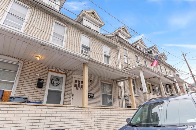 townhome / multi-family property with brick siding