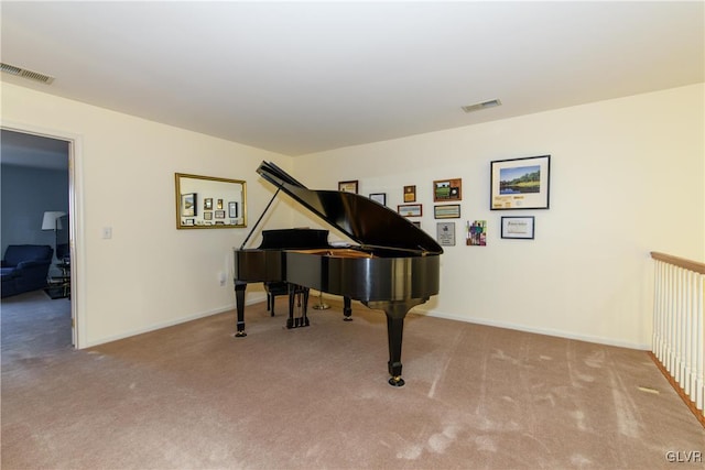 living area featuring visible vents, baseboards, and carpet flooring