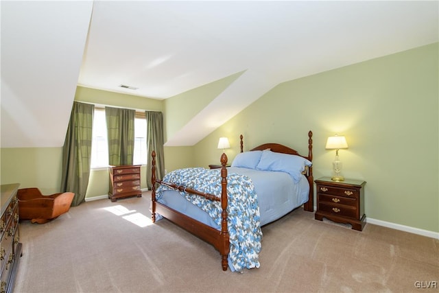 bedroom featuring baseboards, visible vents, carpet floors, and lofted ceiling