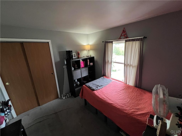 bedroom with carpet and a closet