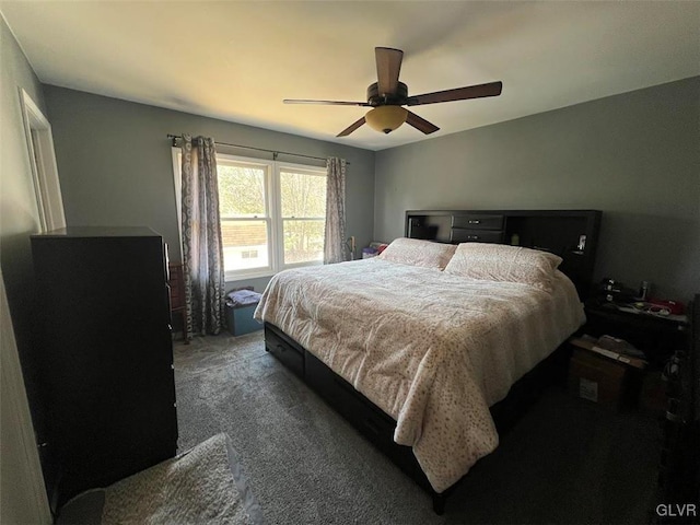 bedroom with a ceiling fan and carpet floors