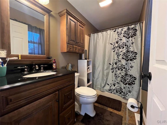 bathroom with shower / tub combo, toilet, and vanity