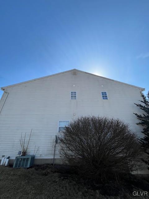 view of property exterior with central AC