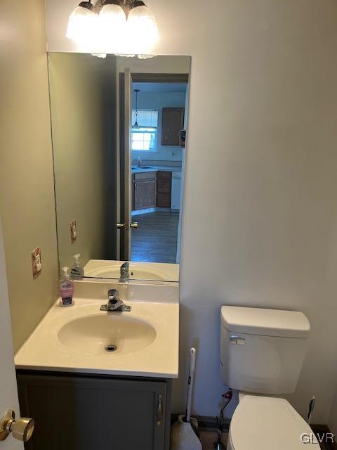 bathroom with toilet and vanity