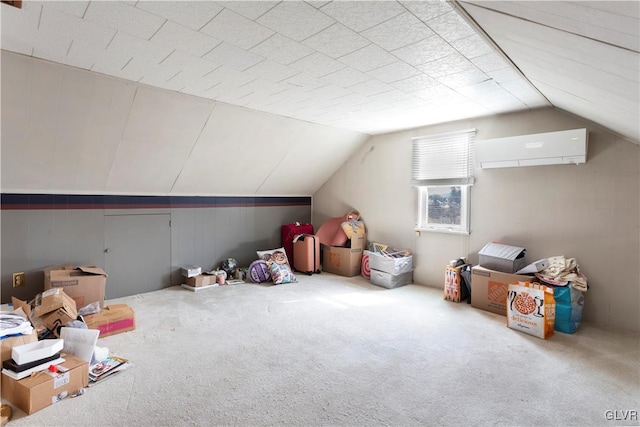 bonus room with carpet flooring, a wall mounted AC, and vaulted ceiling