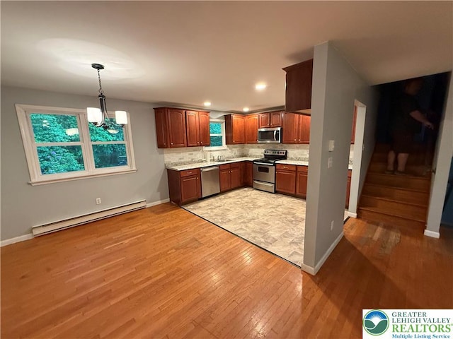 3965 Blacksmith Rd, Weisenberg Twp, PA 18066 - kitchen featuring stainless steel appliances, baseboard heating, light wood-type flooring, baseboards, and recessed lighting