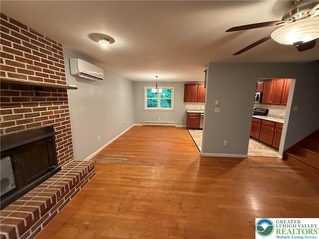 3965 Blacksmith Rd, Weisenberg Twp, PA 18066 - unfurnished living room featuring a wall mounted air conditioner, a baseboard heating unit, light wood-style flooring, ceiling fan, and a brick fireplace