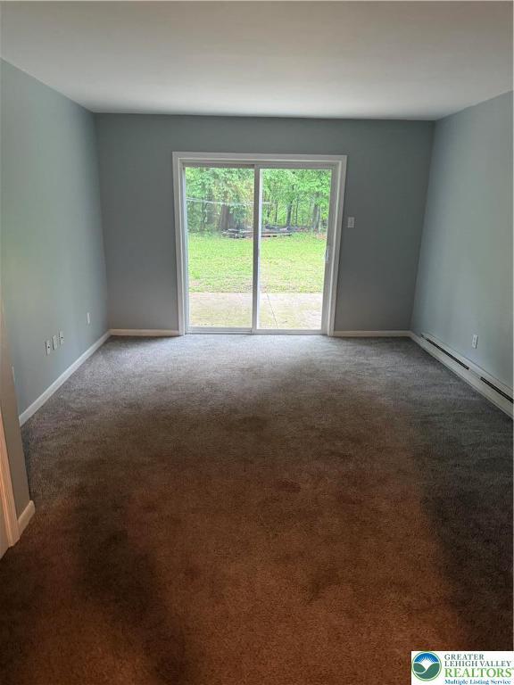 3965 Blacksmith Rd, Weisenberg Twp, PA 18066 - carpeted spare room with a baseboard heating unit and baseboards