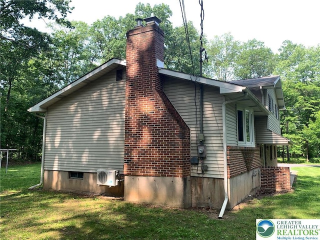 3965 Blacksmith Rd, Weisenberg Twp, PA 18066 - view of home's exterior with a yard, a chimney, and view of scattered trees